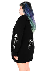 oversized black cardigan with embroidered white fish carcasses