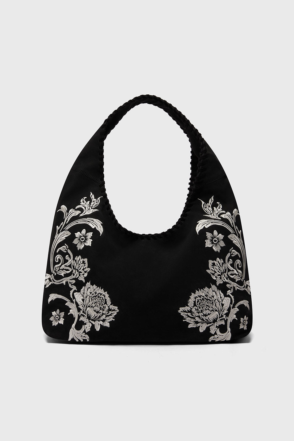Black handbag with floral patterns on a white background