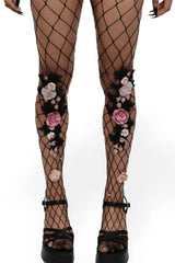 faux flower and leave attached to fishnet stockings 