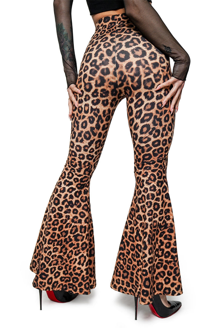 Leopard print flared pants worn by a person on a white background
