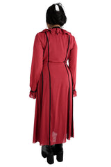 back view of model wearing burgundy Lisa duster from Foxblood with black piping