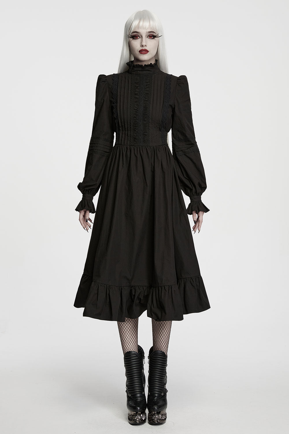 model wearing midi length black dress with ruffle sleeves from punk rave