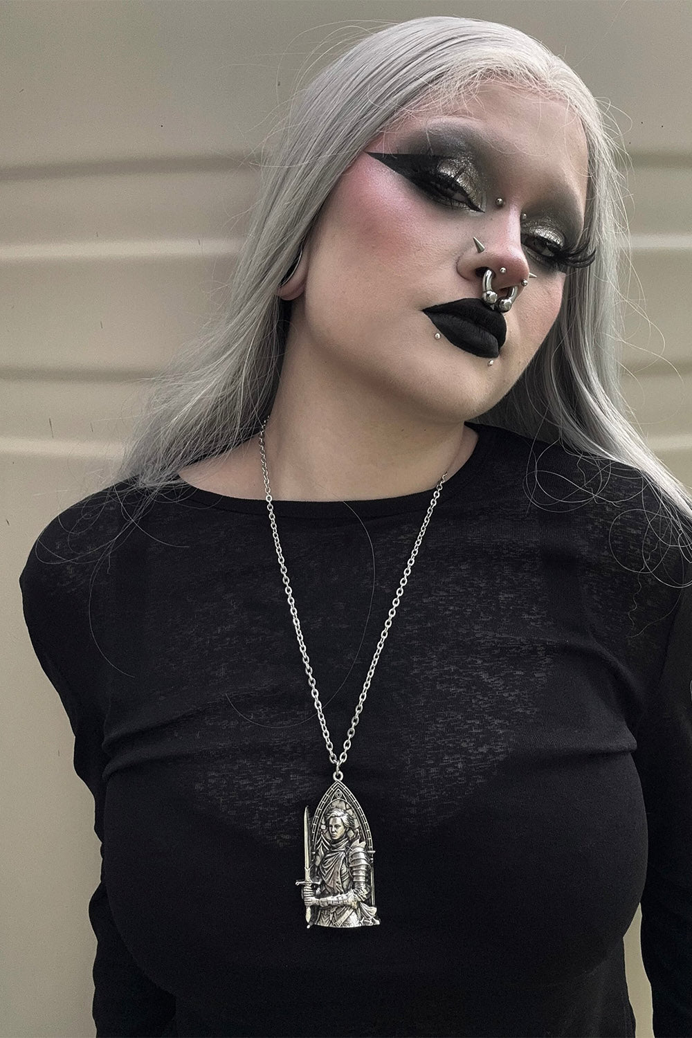 gothic woman wearing gothic renaissance jewelry 