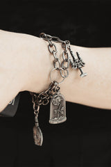dark academia bracelet with book cahrm by the pretty cult 
