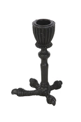 Side view of bird claw candle holder