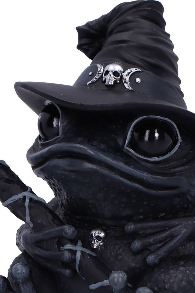 creepy frog statue