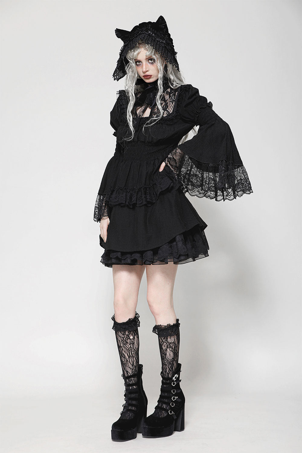Flattering black dress for women with bell sleeves and lace trim
