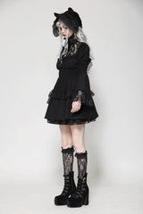 Side view of model wearing dark in love gothic lace doll dress