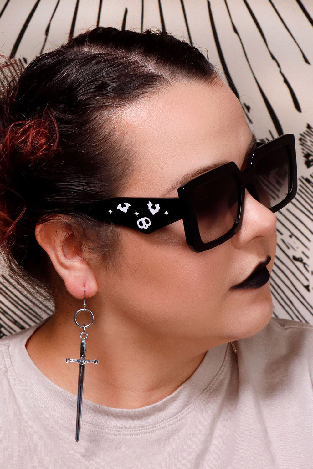 woman wearing gothic oversized sunglasses