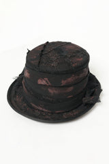 black top hat with red paint accents