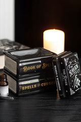 Oil burner designed to look like a stack of spell books