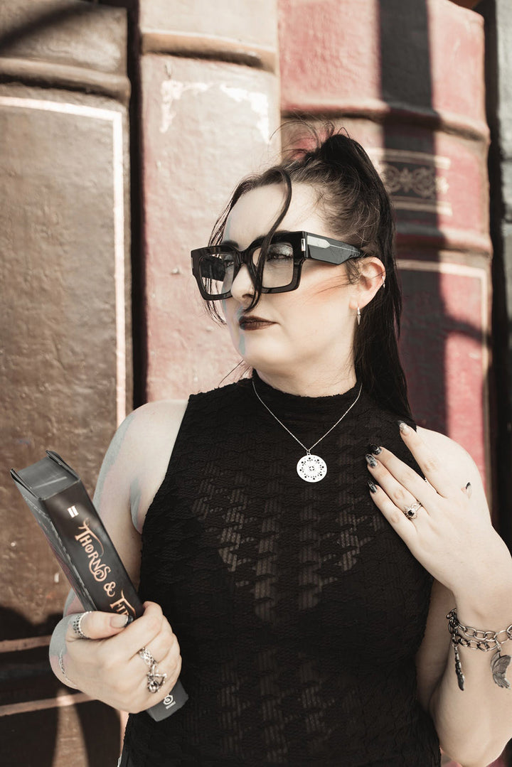 dark academia bracelet with feather, teras, and moth-butterfly charms 