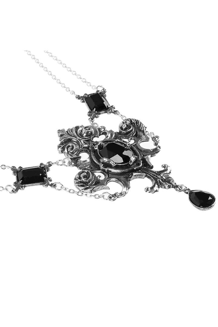 Ornate necklace with black gemstones on a white background