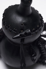 dark witchy bag with raven skull charm