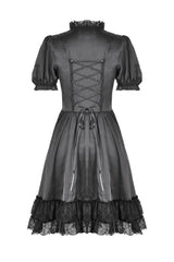 Black lace-up dress with ruffled hem on a white background
