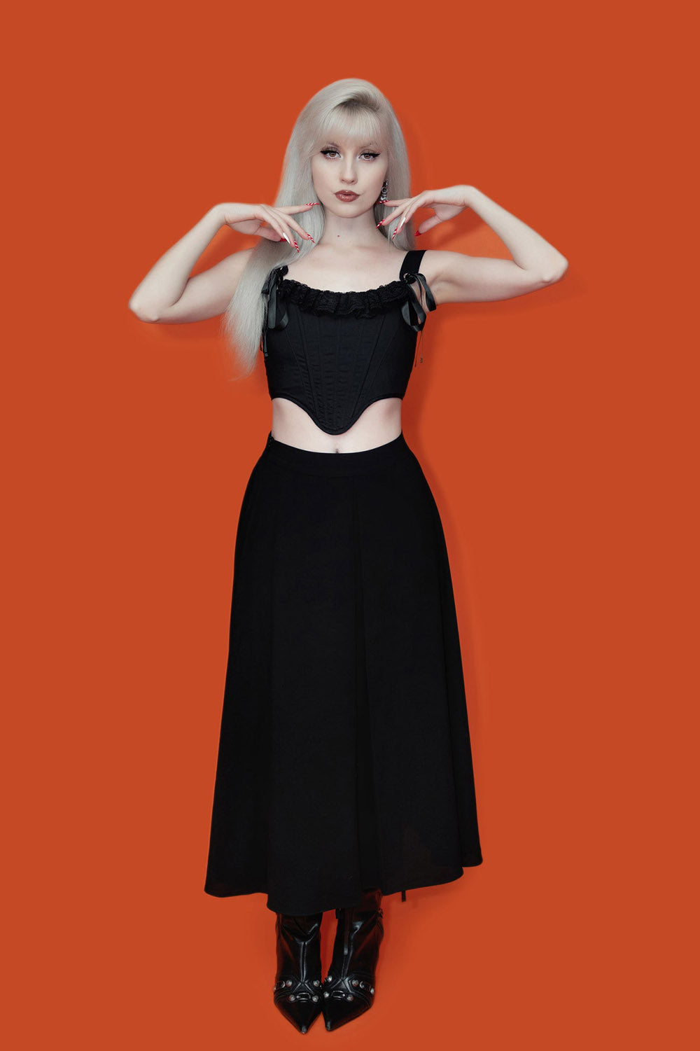 pleated black midi length skirt