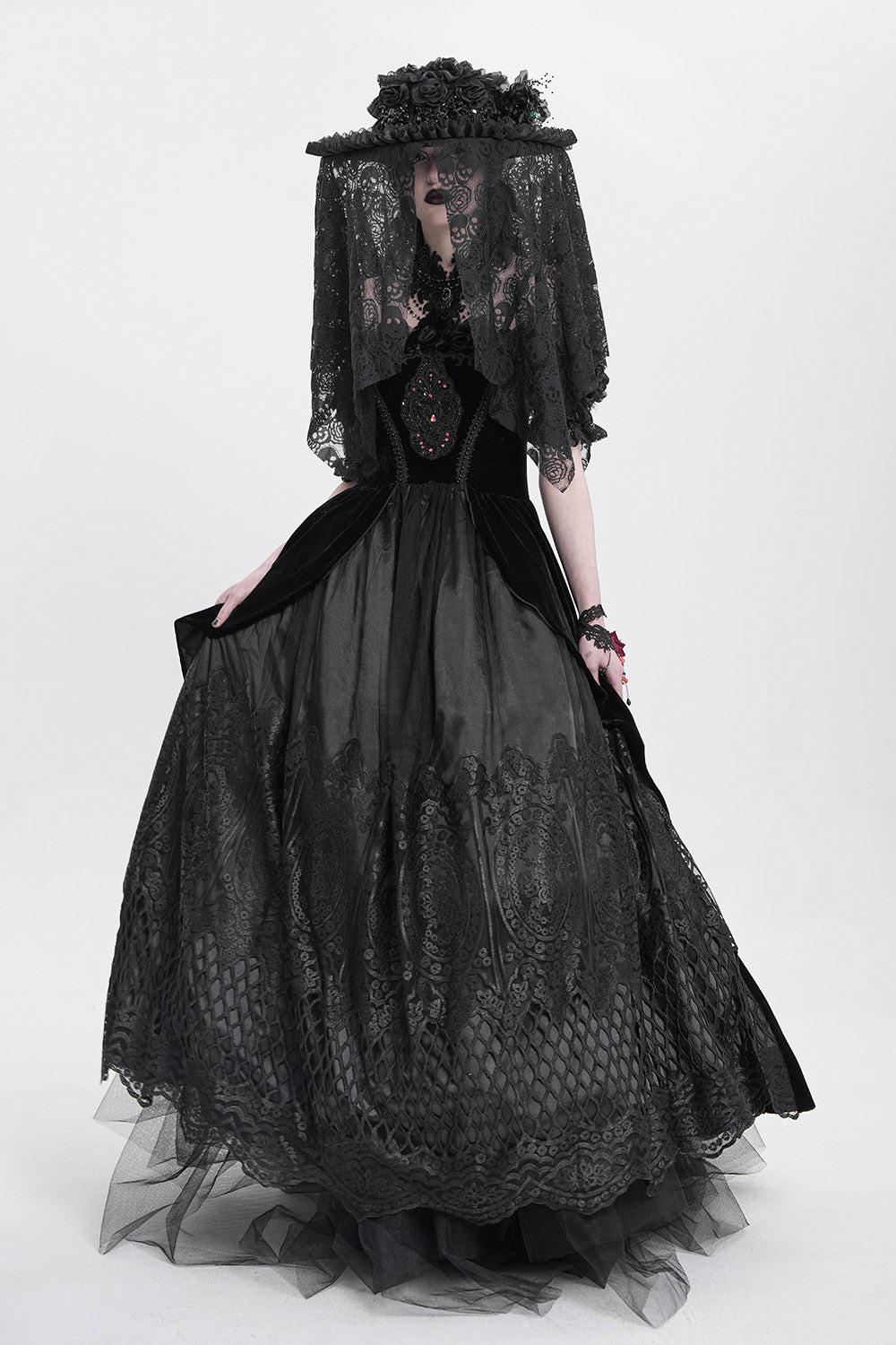 dramatic black hat with faux flowers and beads