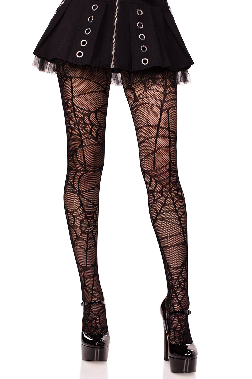 Black spiderweb tights worn with a black outfit on a white background