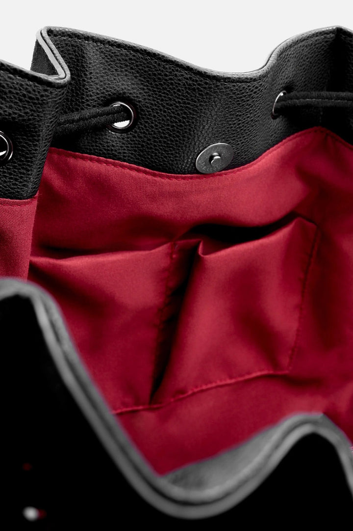 gothic cathedral inspired backpack with red lining 