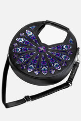 Black handbag with decorative purple and blue patterns on a white background