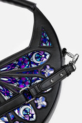 Black leather bag with colorful stained glass-style patterns on a white background