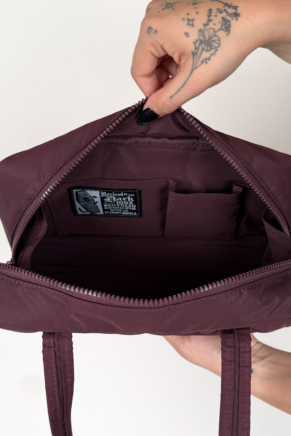 inside a recycled nylon gothic baguette shoulder bag 