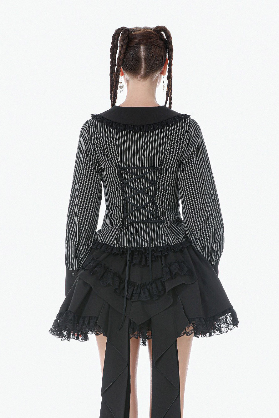 gothic woman wearing a long sleeves womens striped blouse with puffed sleeves and corset back