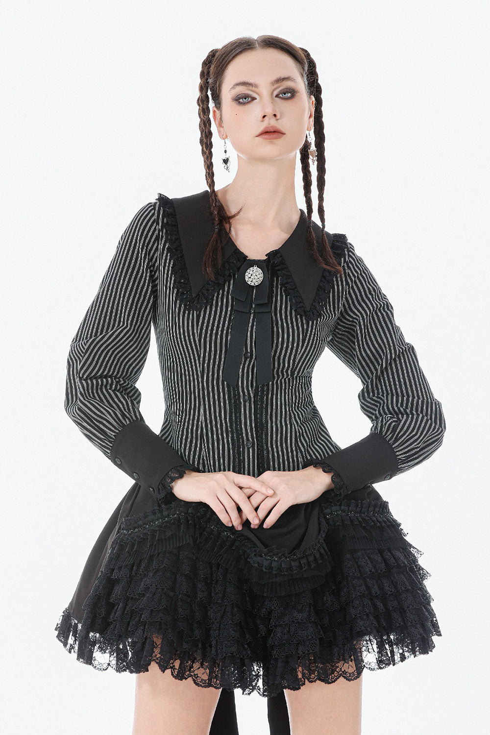 gothic woman wearing a long sleeves womens striped blouse with puffed sleeves and black cuffs