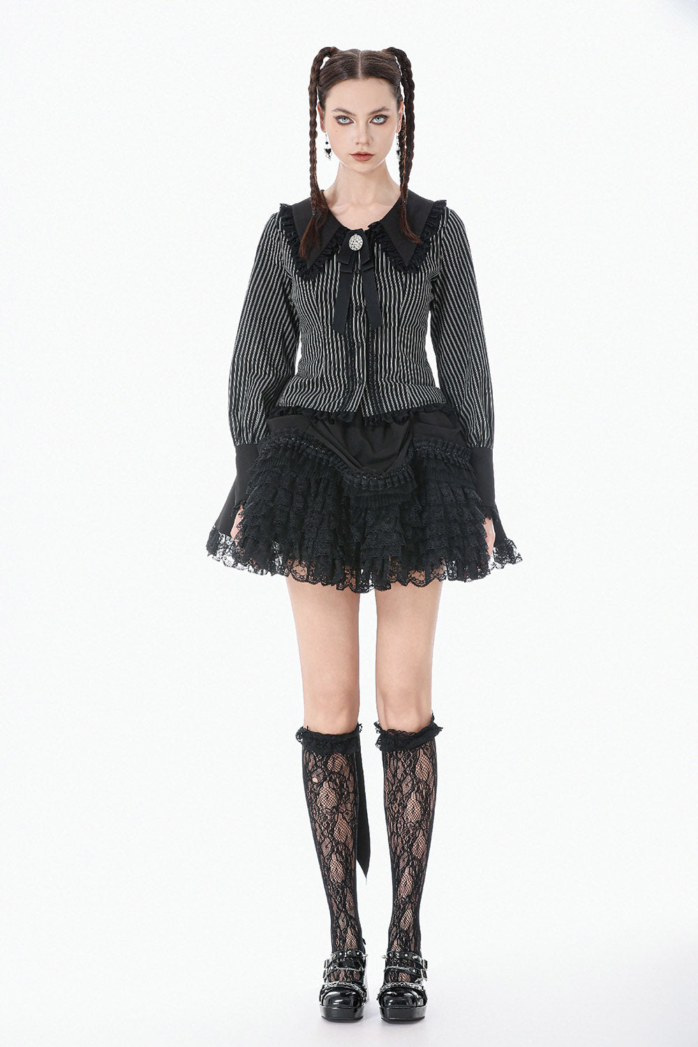 gothic woman wearing a long sleeves womens striped blouse with puffed sleeves and bowtie