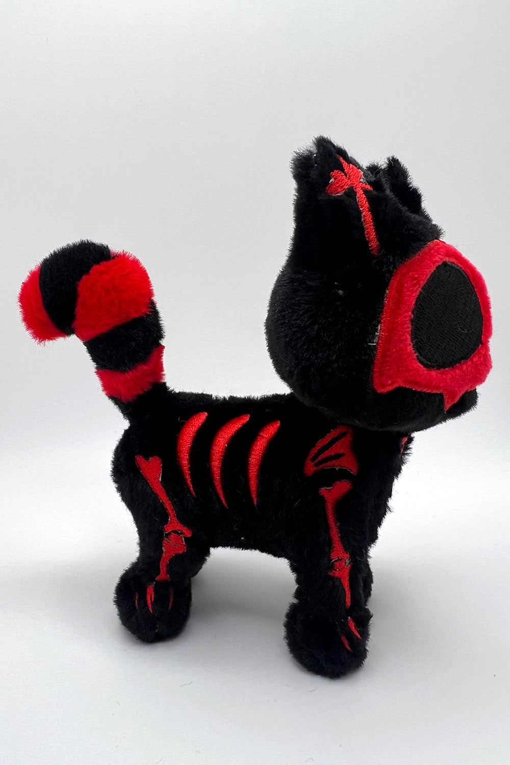 creepy cute red and black skeleton bones cat toy