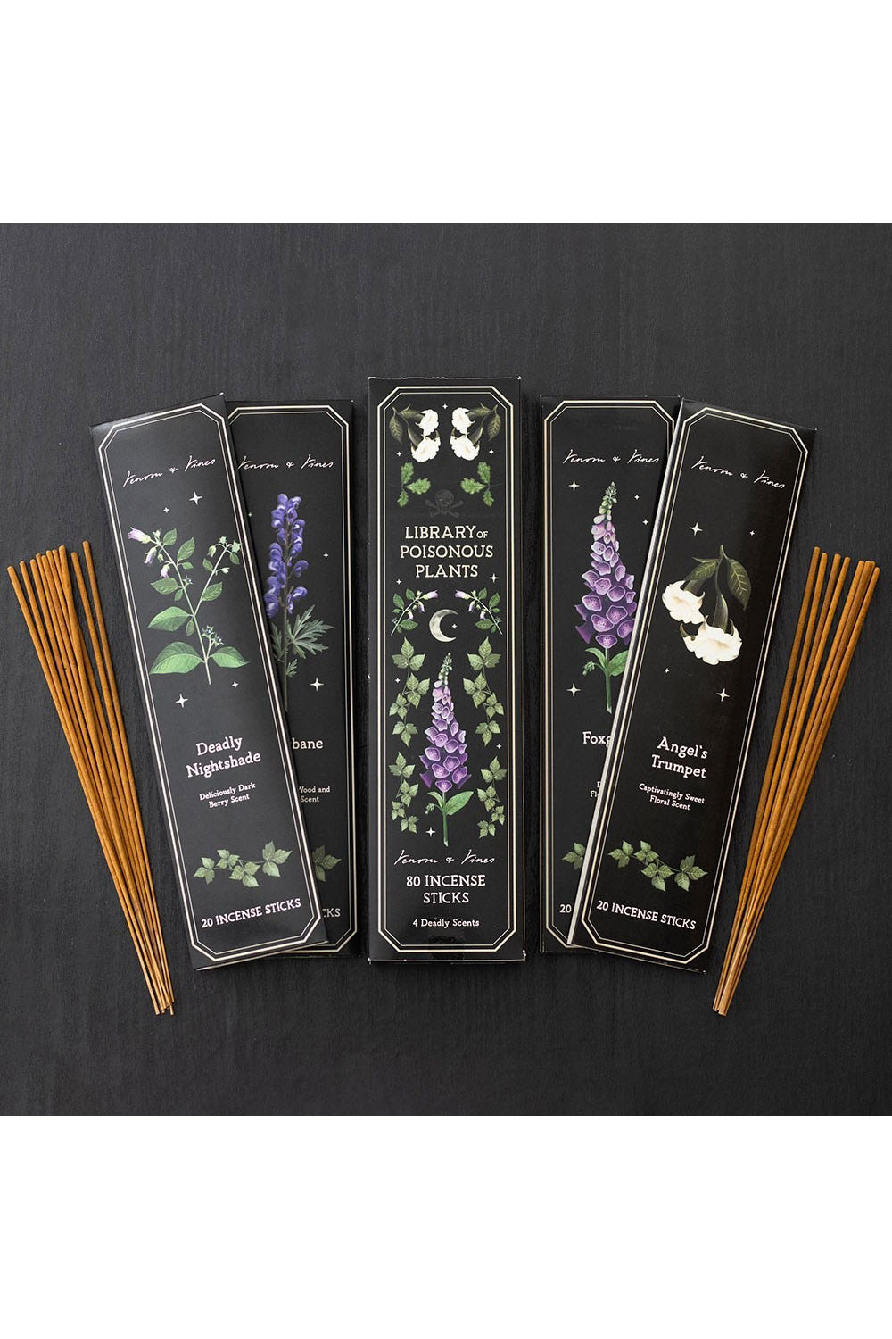 Set of incense sticks with decorative packaging on a dark background