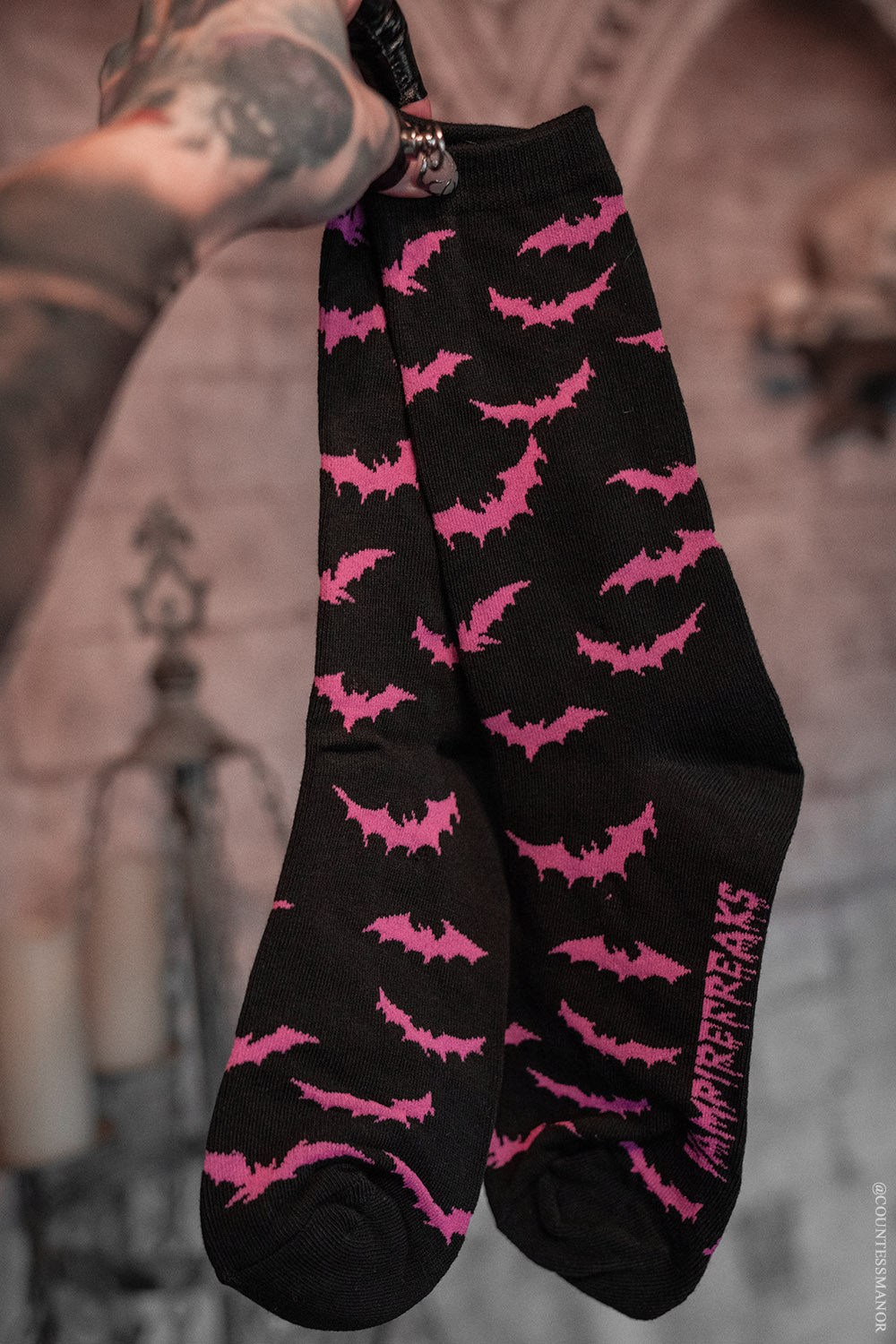 black and pink bat socks