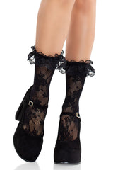 Black lace socks with decorative elements on a white background