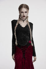Woman in gothic attire with braided hair and dark clothing on a white background