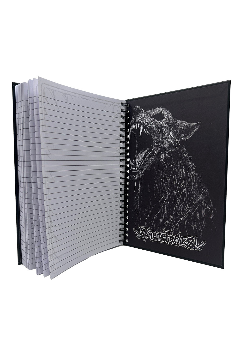 Notebook with a wolf illustration on the cover, open to reveal lined pages.