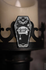 black coffin-shaped enamel pin