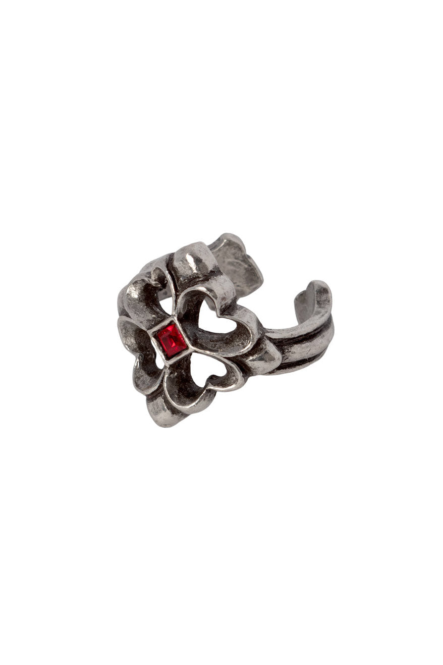 A silver-toned metal ring with a textured, sculptural design featuring a small, square-cut red gemstone in the center, set against a plain white background.