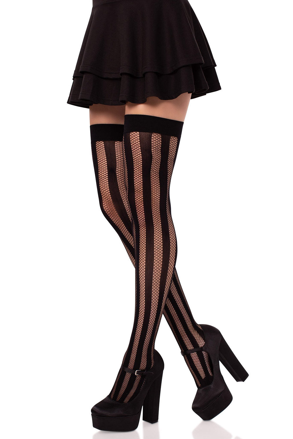 Black fishnet thigh-high stockings worn with a black skirt and high heels on a white background