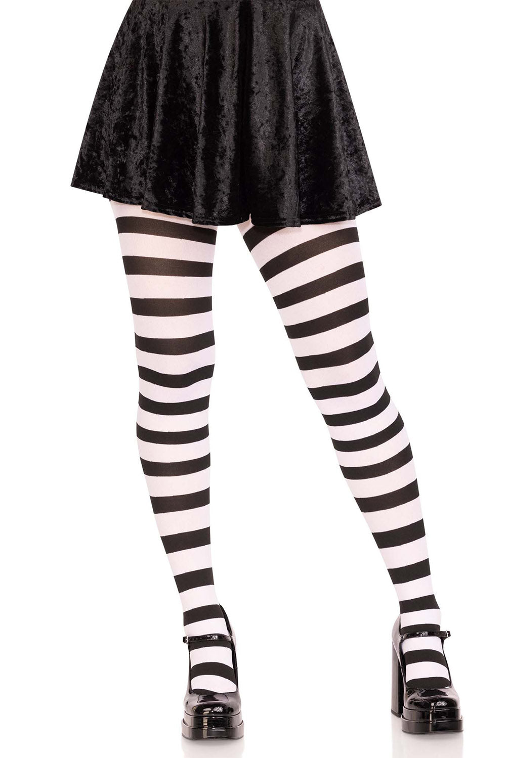 Black and white striped tights worn with a black skirt on a white background