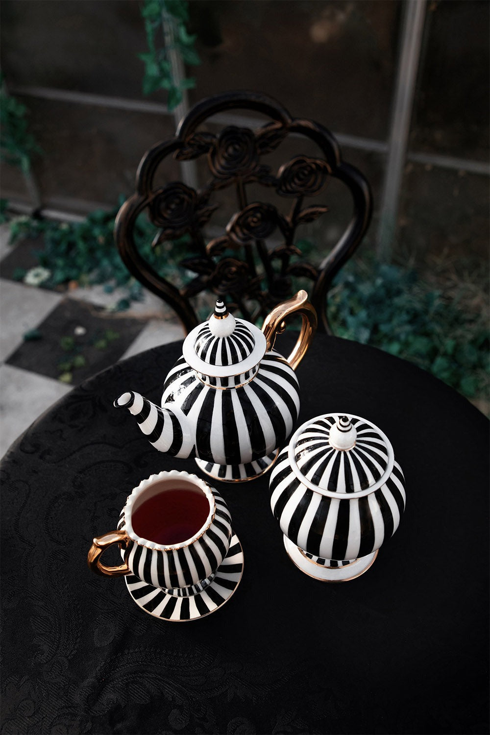 dark whimsical black and white striped teapot and tea cups