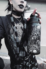 gothic girl holding a stainless steel large horror raven skeleton water bottle 