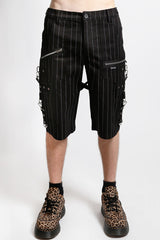 Black pinstripe shorts with zippers worn by a person on a white background