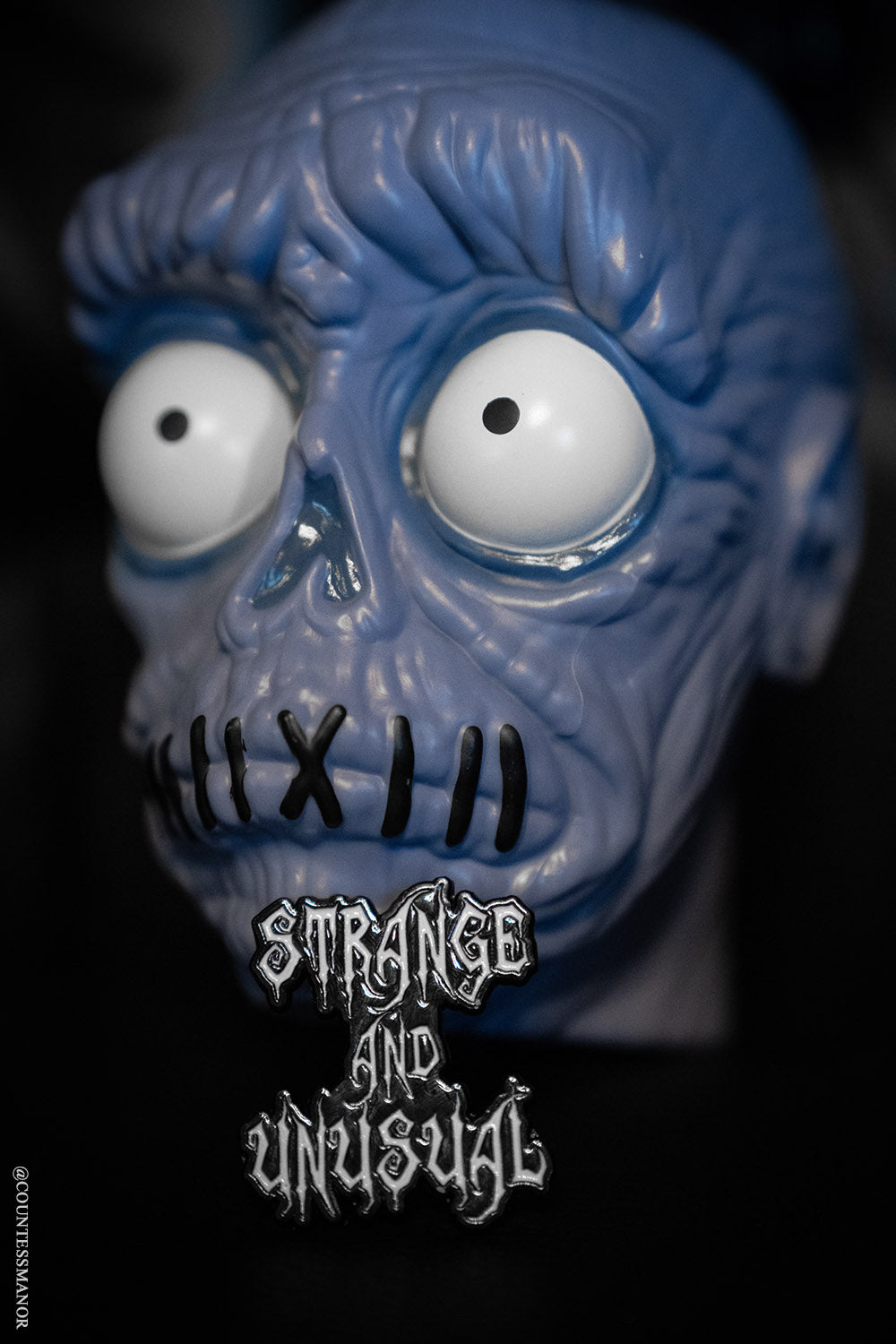 Strange and Unusual Enamel Pin