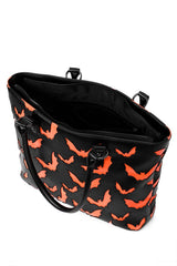 Black tote bag with orange bat pattern on a white background