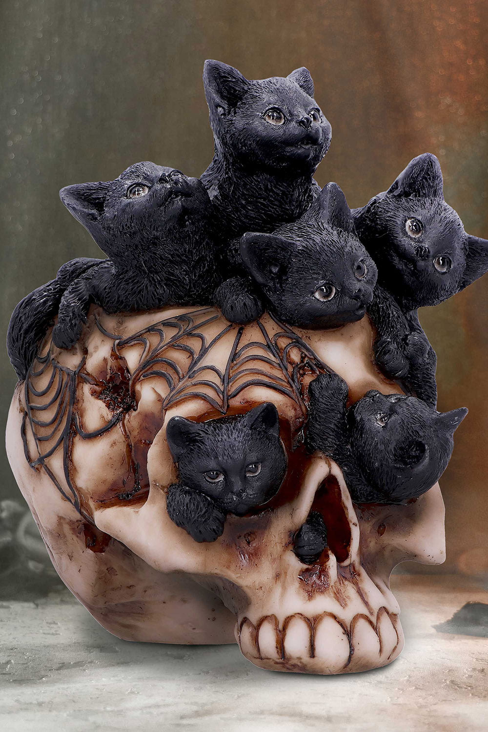 gothic statue of cats and human skull