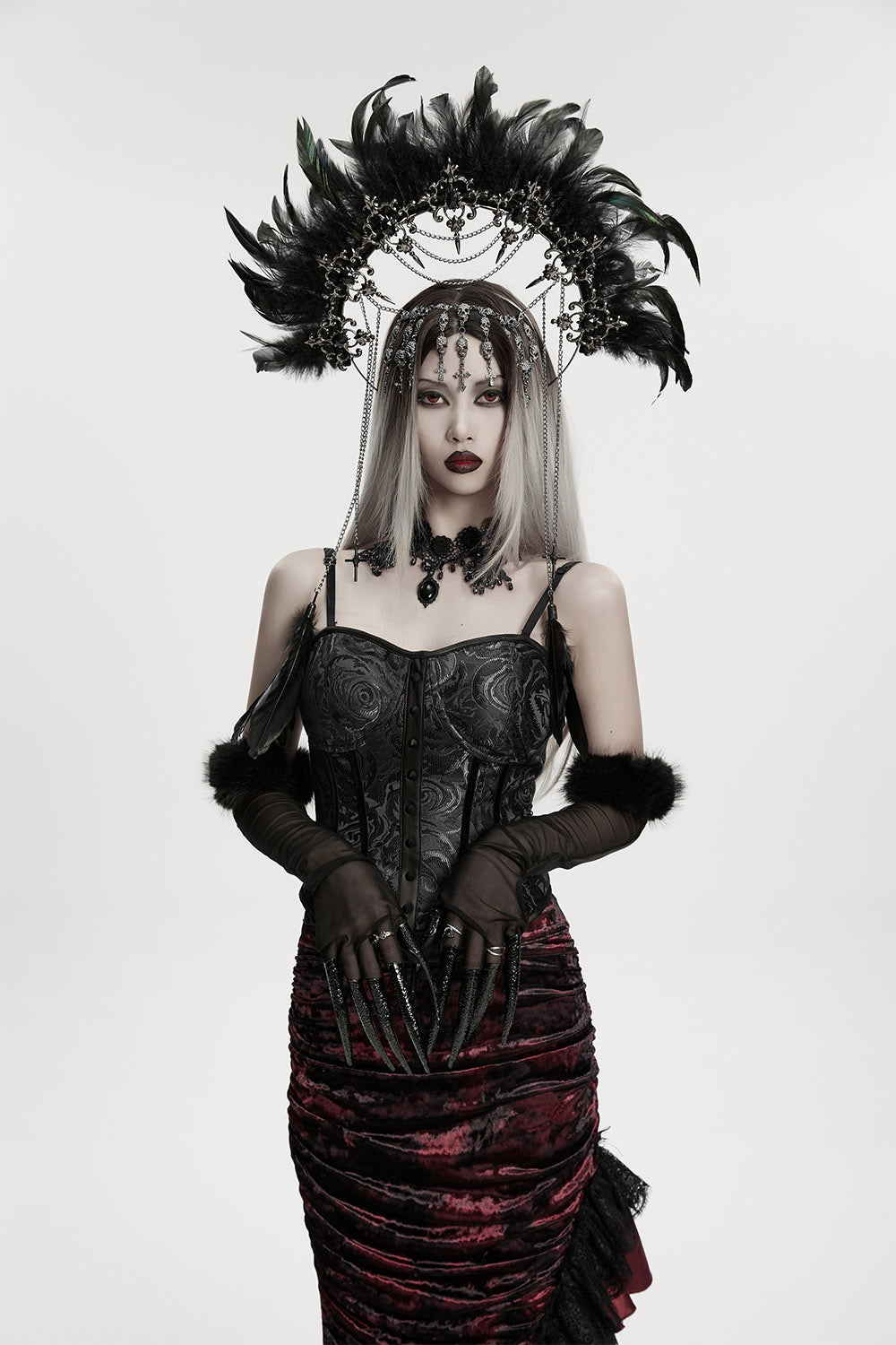 ornate feather, skull, and gothic cross headpiece 