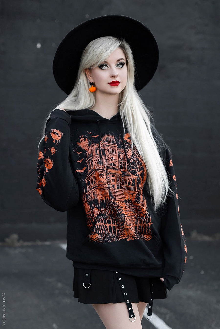 orange and black haunted house hoodie