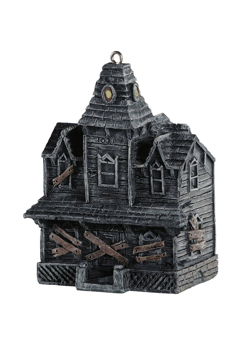 Decorative haunted house xmas ornament on a white background