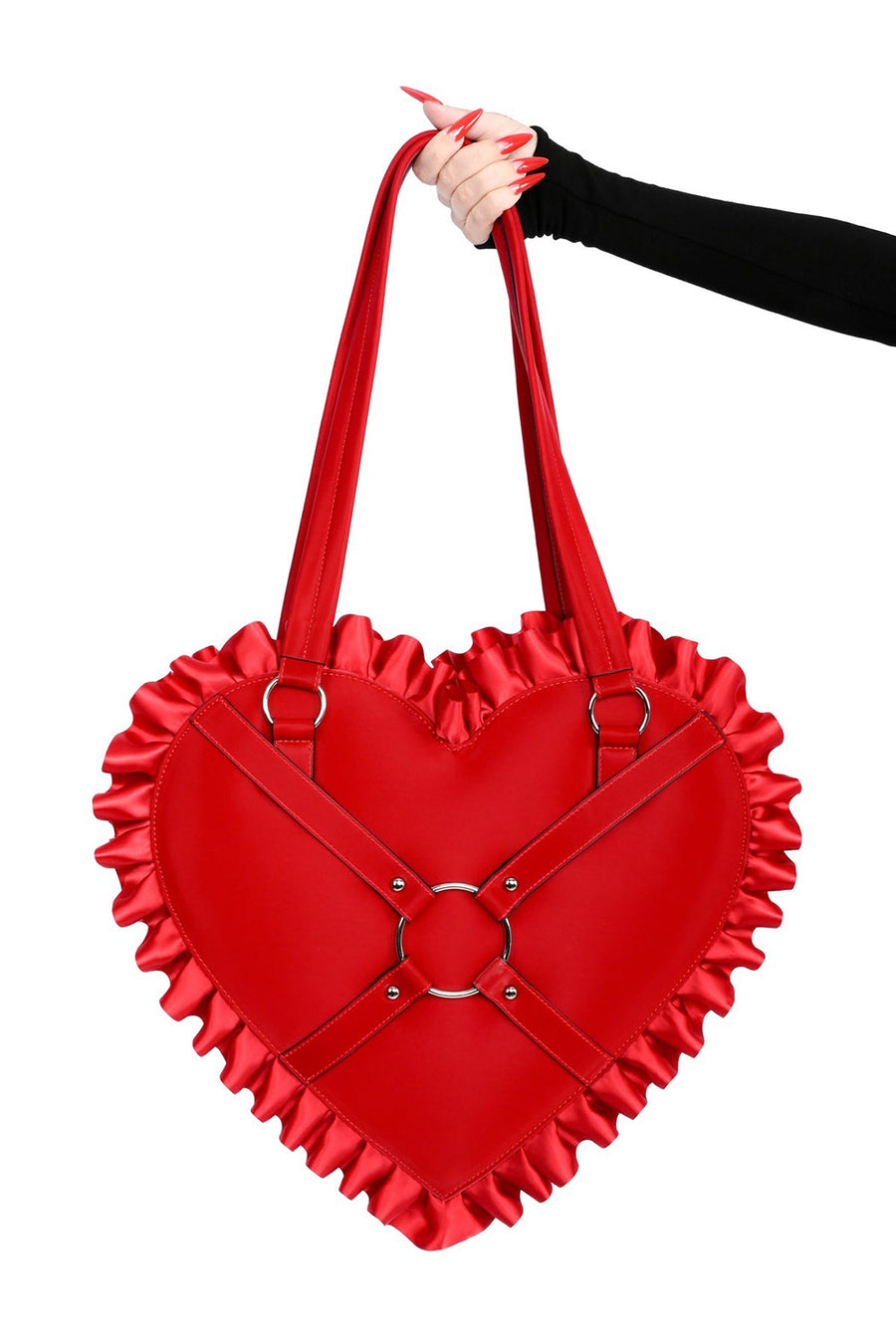 Red heart-shaped handbag held by a hand on a white background