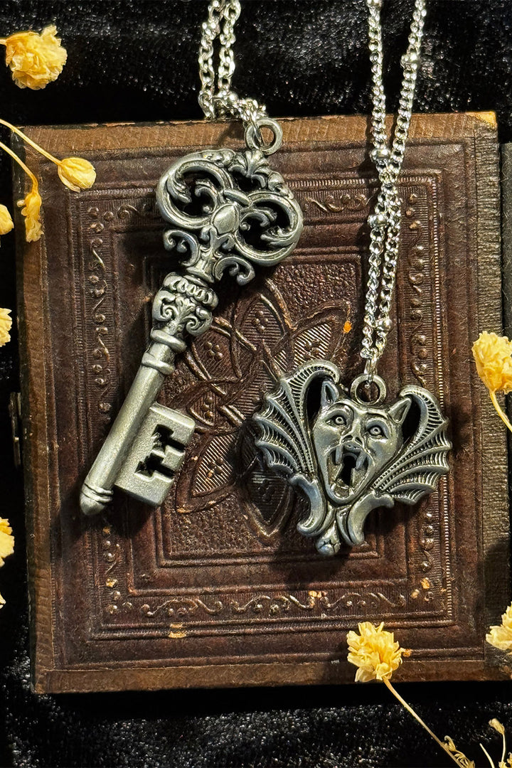 gothic key necklace and a bat necklace